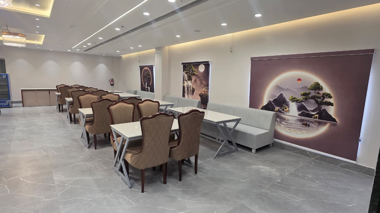 Dining hall with artwork panels and bench seating