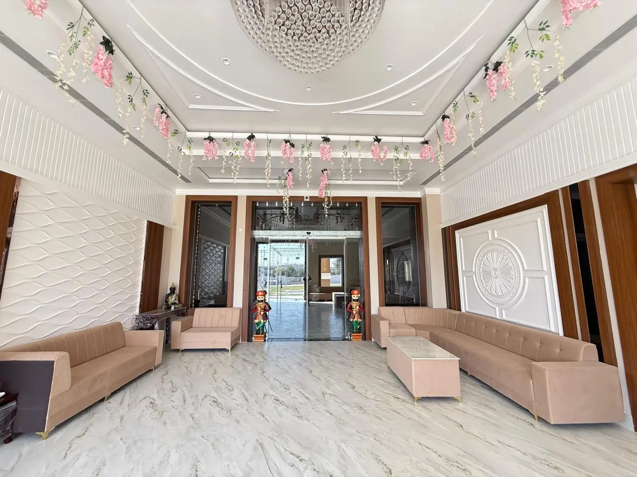 Entrance foyer with floral decoration and lounge seating