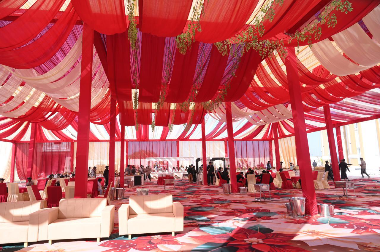Draped celebration hall with seating and buffet